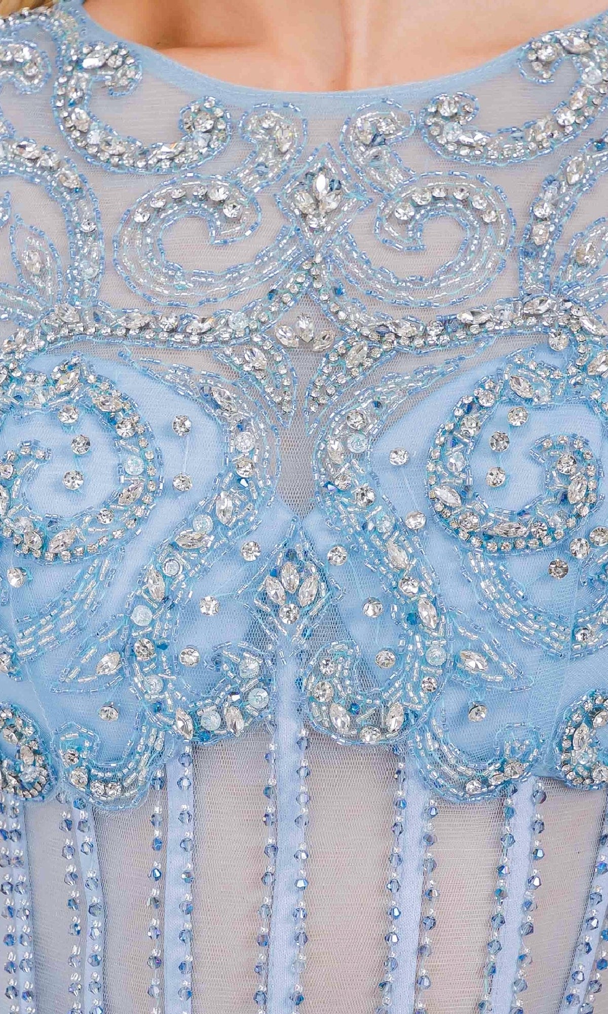 Close-up of a light blue dress with intricate beadwork and embroidery.